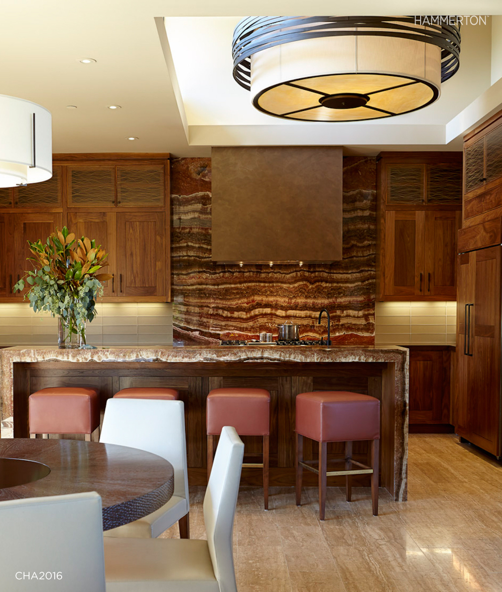 A boldly scaled CHA2016 chandelier, 6 feet in diameter, provides a powerful focal point in this Silicon Valley kitchen. Interiors by Pennington Design Studios.