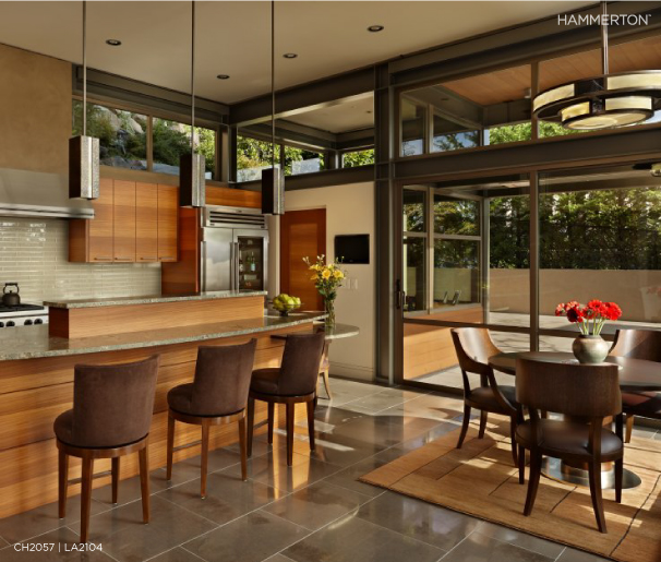 A Hammerton CH2057 dining light and three LA2104 fixtures above the island bar add Contemporary sophistication to this lakefront kitchen. Architecture and interiors by McClellan Architects.