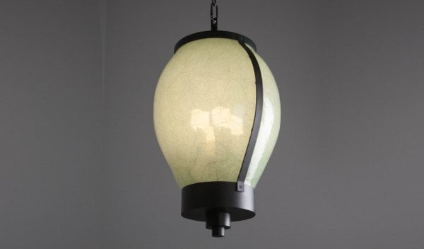 Also for the Many Glacier Hotel, this large-scale bulb pendant is custom crafted with a slumped organic ecoresin lens material and matte black finish.
