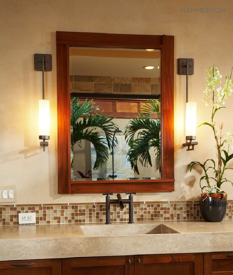 Exotic woods, a beach-inspired color palette and two Contemporary ID2066 wall sconces evoke sophisticated tropical style in this Hawaiian powder room. Interior design by Willman Interiors.