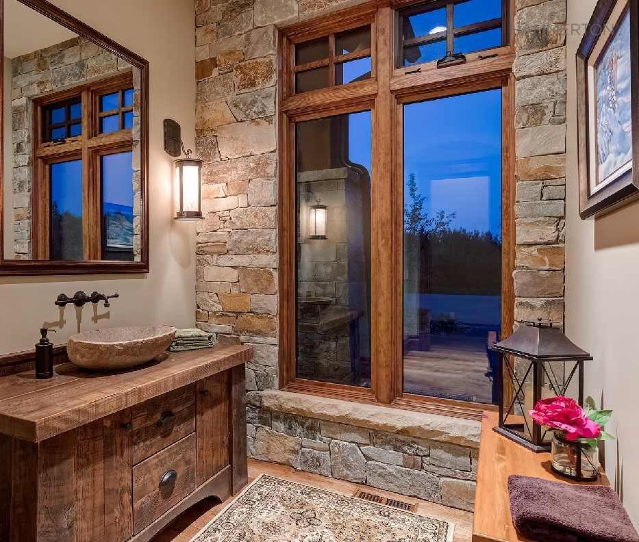 Hand hewn finish materials and a modified Chateau ID9212 wall sconce lend frontier elegance to this Calgary powder room.