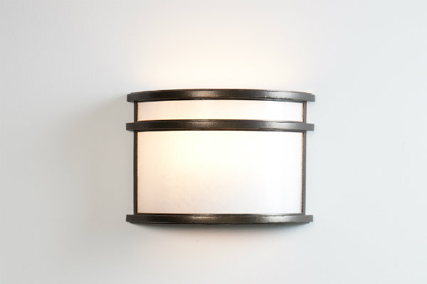 With its striking simplicity, this cover sconce can be placed on either side of a headboard to add an elegant allure to contemporary bedrooms.