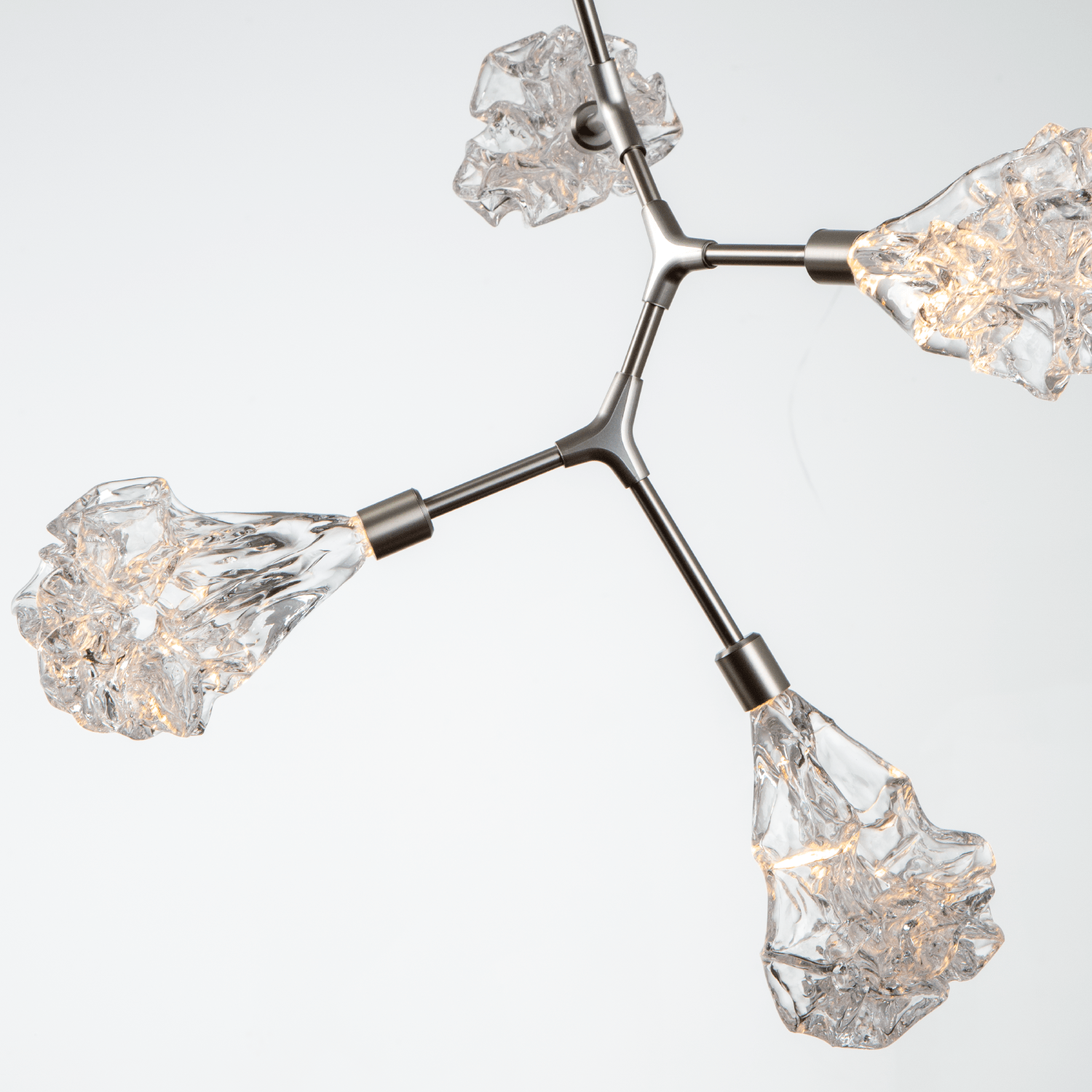 Detail of a Hammerton Studio Blossom modern branch light fixture with metallic beige silver finish