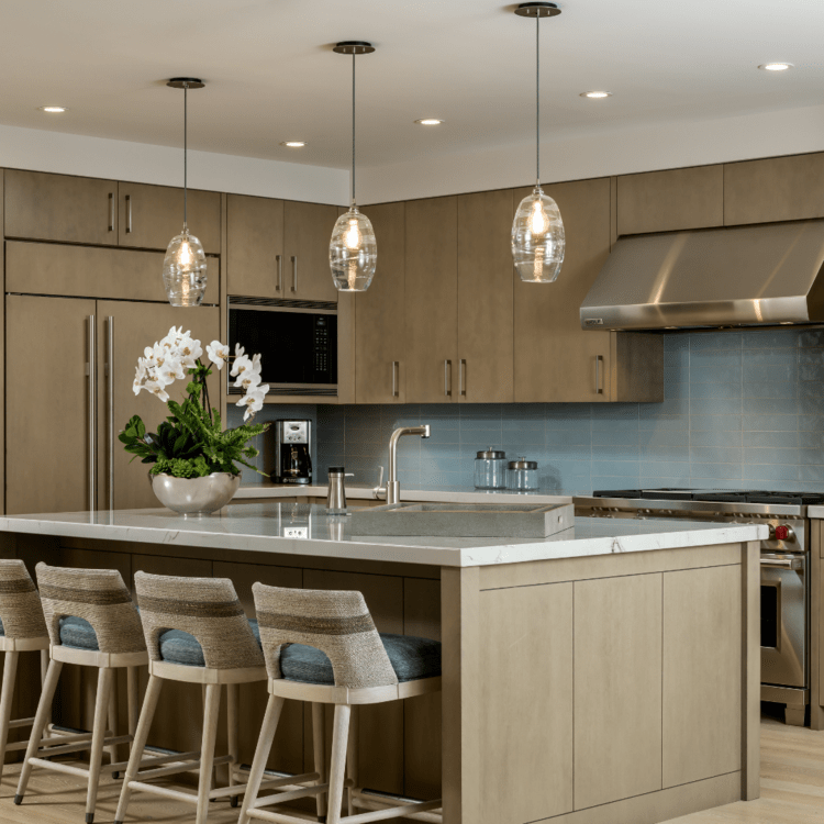 Optic Blown Glass pendants over a modern farmhouse island