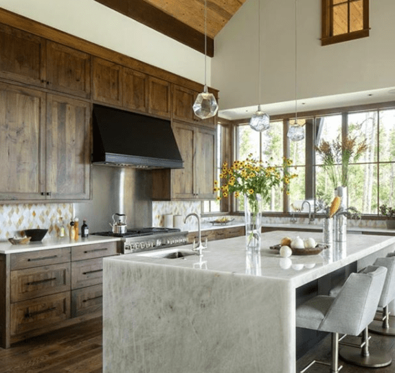 Gem pendants over a modern farmhouse kitchen island.