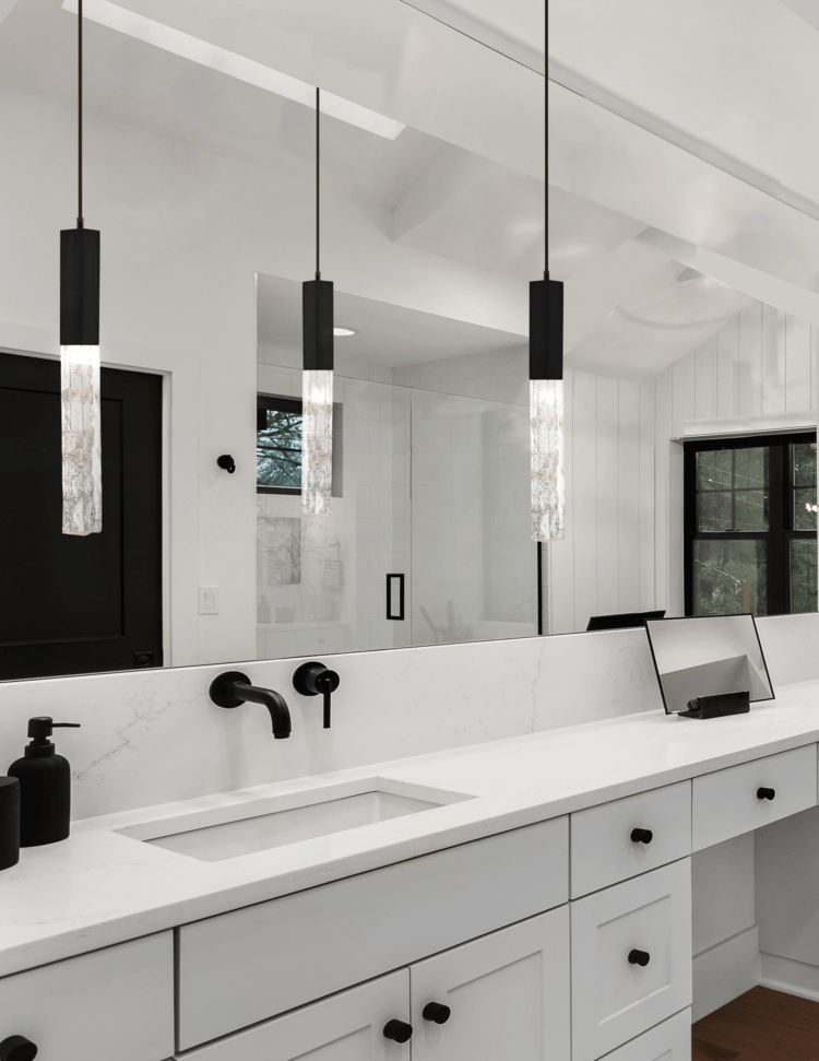 Axis pendants in a black and white modern farmhouse master bathroom.