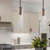 Beautiful kitchen in new luxury home with waterfall island, quar