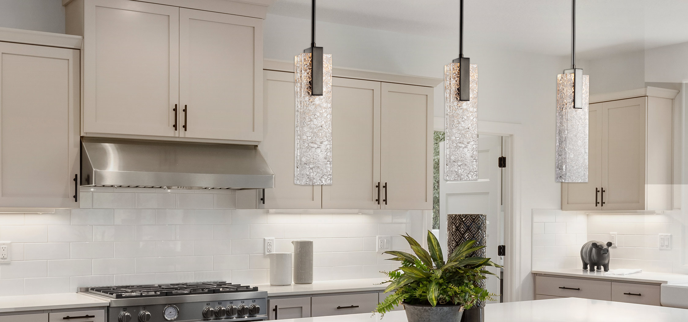Beautiful kitchen in new luxury home with waterfall island, quar