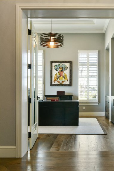 A Tempest drum draws the eye upward in this clean-lined office.&nbsp;