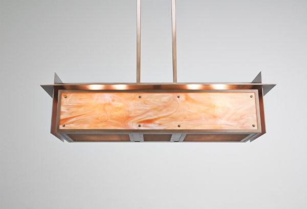 This pool light design is an artistic interpretation of some of the most basic concepts idealized by Frank Lloyd Wright. Stark lines and junctions are modernized by unexpected, contemporary materials, including polished metal and blown glass to achieve an unusual statement piece.
