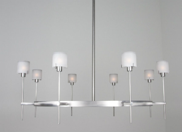  Perfect for an industrial loft or contemporary space, this brushed nickel finished chandelier features a sleek form and custom shades for a sophisticated look. 