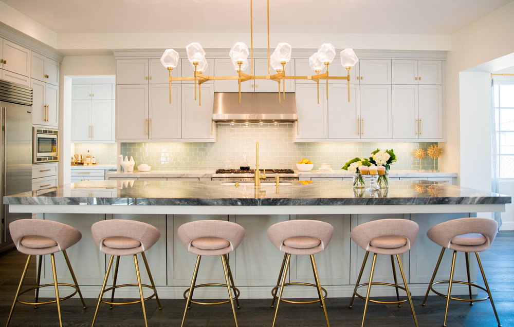 This glamorous modern kitchen features a Gem Belvedere linear suspension in Gilded Brass finish. Designer Jaki Yermian is making a name for herself and her Carlsbad, CA based firm JY Design Interiors with her ethereal designs. 