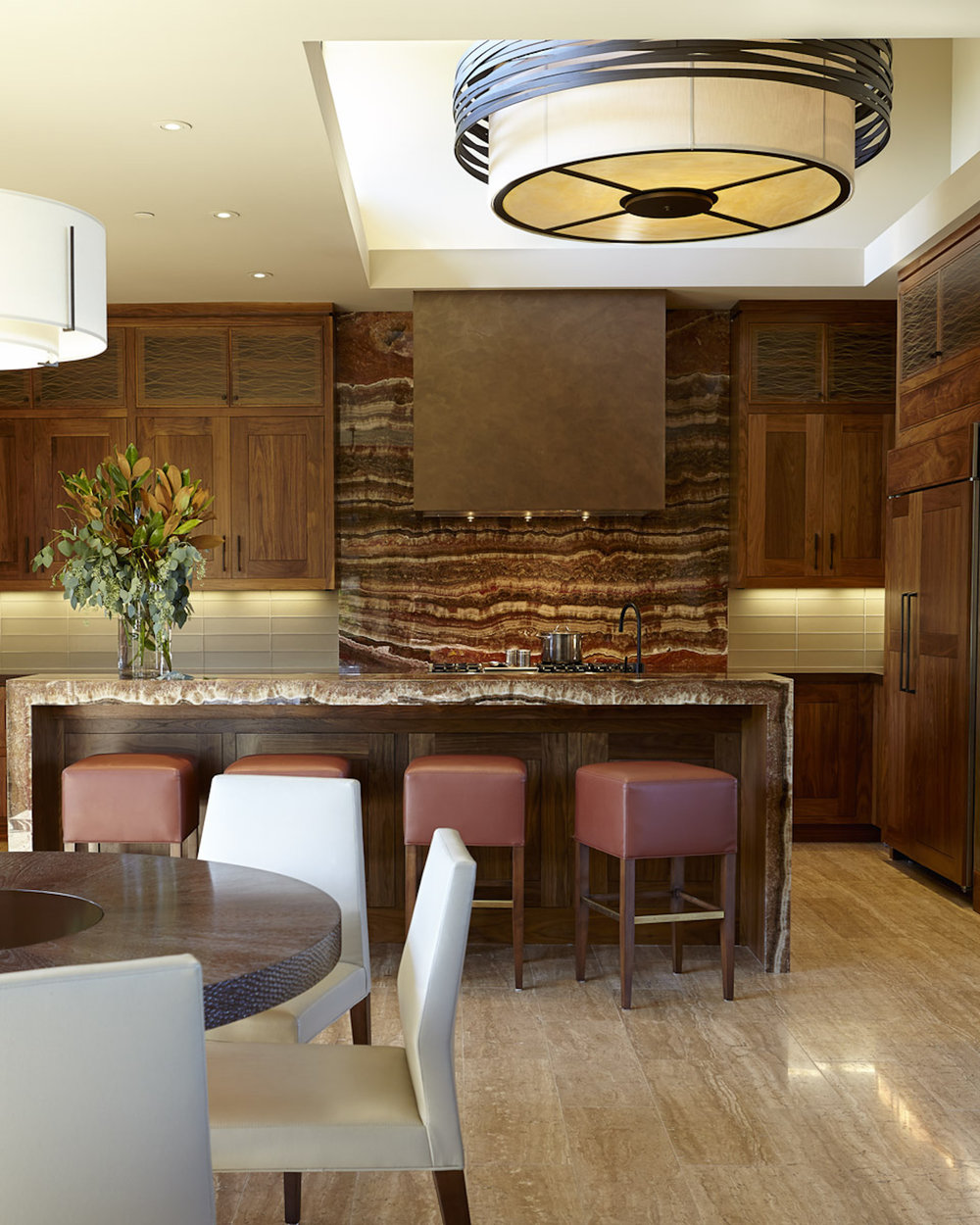 Six feet in diameter, a CHA2016 drum chandelier from the Hammerton Fusion collection makes a big design statement in this contemporary kitchen.