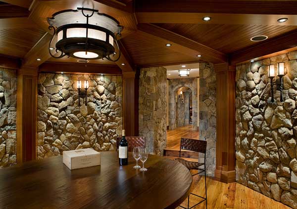  Graceful curves were combined with a bold use of antique iron-finished steel to achieve this unique custom ceiling fixture, which serves as the centerpiece in the cellar's tasting room. 
