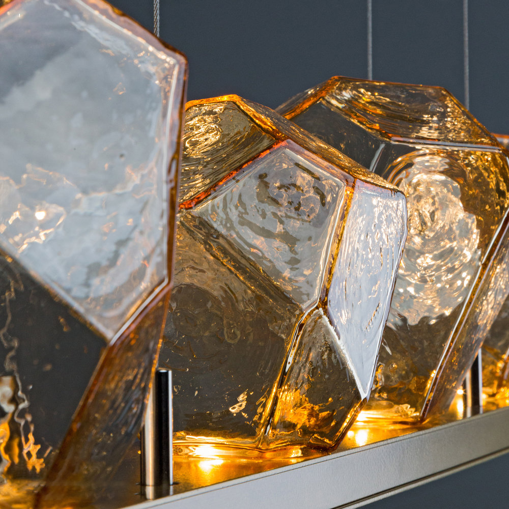 Gilded Brass finish with amber glass