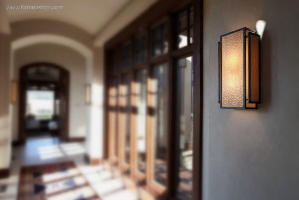 Like water droplets gently rippling in the wind, the texture of this custom glass sconce easily catches the eye.
