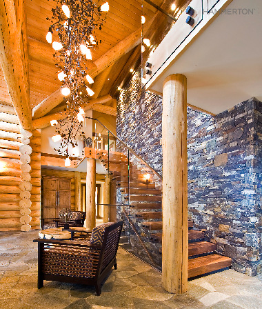 A cascading fixture of glittering aspen branches, sculpted in steel, provide an eye-catching focal point in this Canadian retreat. Interiors by Sticks & Stones Design Group.