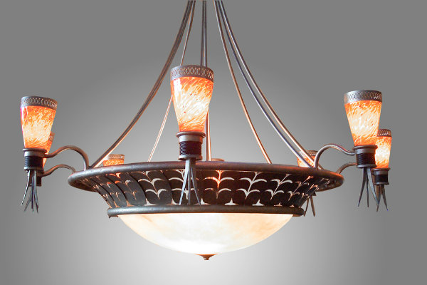  This extraordinary Tuscany-inspired alabaster chandelier features impressive metalwork and lava-style blown glass shades for a look that's nothing short of remarkable. 