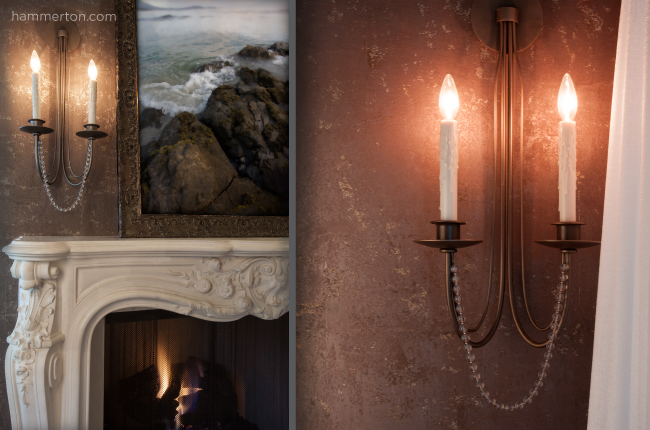 Beautiful beaded wall sconce featuring two candlestick lights
