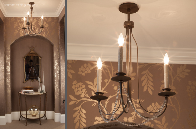 A simple yet elegant chandelier featuring custom beadwork and three candlestick lights