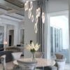 A Hammerton Studio  Rock Crystal round multi-port  strikes the perfect balance between traditional and modern in this  cozy dining nook by Soco Interiors | Florida, New York, Ohio, Jackson Hole