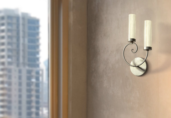 Whimsical scroll work sconce