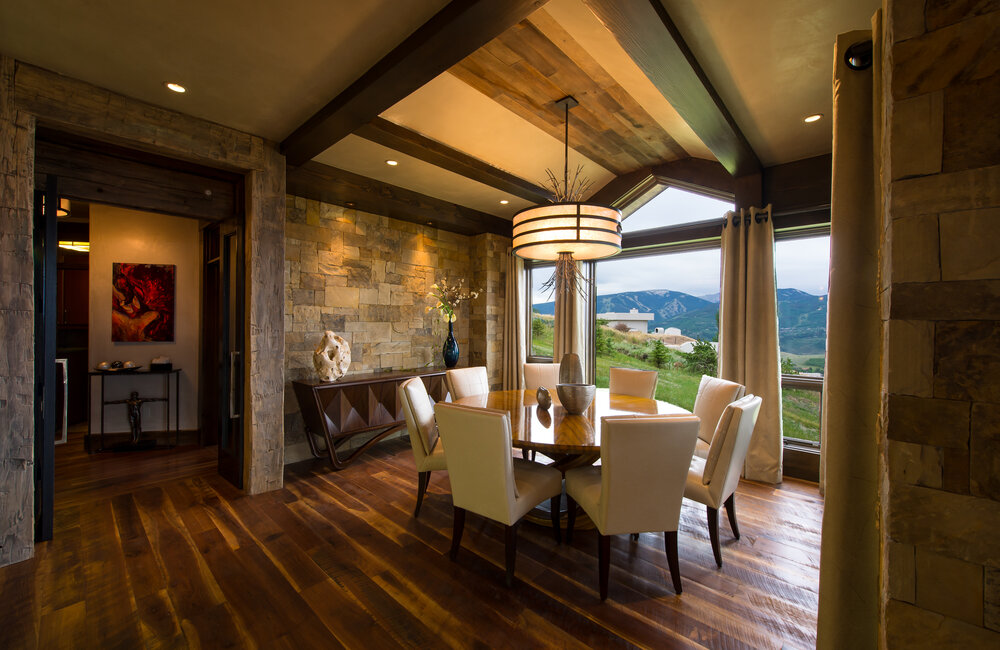 This custom drum pendant incorporates organic elements to complement a stunning Colorado view | AP Resort Concepts | Vail Colorado
