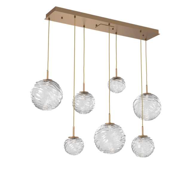 PLB0092-07-NB-C-Hammerton-Studio-Gaia-7-light-linear-multi-pendant-chandelier-with-novel-brass-finish-and-clear-blown-glass-shades-and-LED-lamping